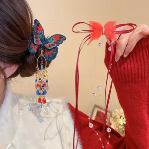 Elegant Chinese style butterfly hair clip with colorful tassel beads and red ribbon bow