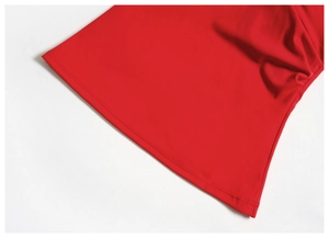 Close-up of precise stitching and premium texture on red V-neck yoga tank top hem