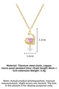 Detail of moon and pink heart pendant with micro-pave crystals on gold titanium chain