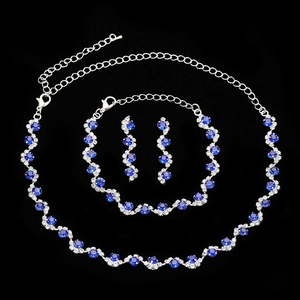 Elegant bridal jewelry set with sapphire blue stones, necklace, bracelet and earrings