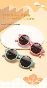 Detail view of pink and mint green TPEE flexible round frames for baby polarized sunglasses