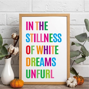 Detail of colorful lettering in a wood frame on a desk with autumn pumpkin decor
