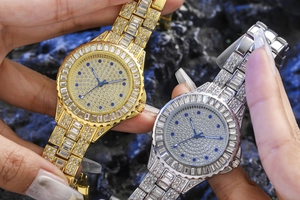 Detailed view of gold and silver luxury quartz watches encrusted with shimmering crystals