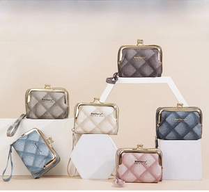 Detailed grid layout showing varied colors of quilted fabric mini kiss-lock purses with handles