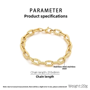 Macro detail of gold stainless steel O-chain bracelet with textured ring links