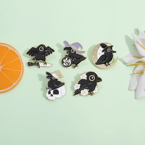Five-piece black crow enamel pin set featuring gothic raven and skull designs with gold trim