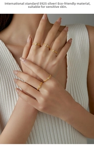 Detailed close-up of S925 sterling silver gold-plated chain rings with diamond letter charms