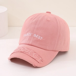 Close-up of pink cotton baseball cap with Paris Best embroidery and distressed brim detail