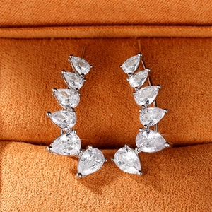 Minimalist pear-shaped zircon crawler earrings with six stones in a silver-toned setting