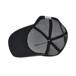 Detail view of the breathable black mesh back and adjustable strap on the baseball cap