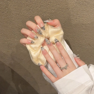 Handmade stiletto press-on nails with grey-white snake pattern and silver cross charms
