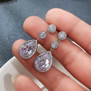 Elegant silver teardrop halo earrings with AAA cubic zirconia stones for bridal party wear