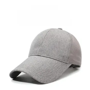Detail of light gray sun hat featuring breathable mesh panels and SDR metal emblem
