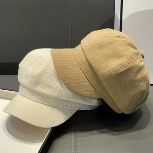 Stylish octagonal newsboy cap with textured jacquard check in beige and khaki colors