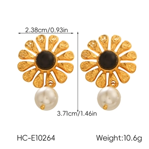Detailed view of gold flower earrings with white pearl drop and size measurements
