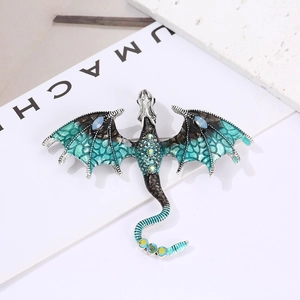 Vintage enamel dragon brooch with blue gradient scales and sparkling rhinestones