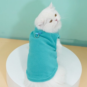 Close-up of soft turquoise fleece pet vest with metal D-ring for leash attachment