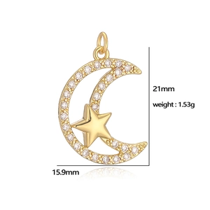 Macro detail of a moon and star pendant with zircon stones and dimensions 21x15.9mm