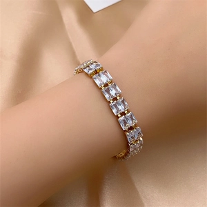 Detailed macro view of luxurious tennis bracelet with sparkling rectangle cut zircons