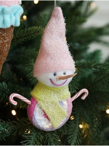 Pink snowman ice cream pendant hanging on a Christmas tree with iridescent finish