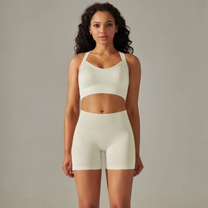 Front view of seamless high-waist cream yoga set with ribbed breathable fabric texture