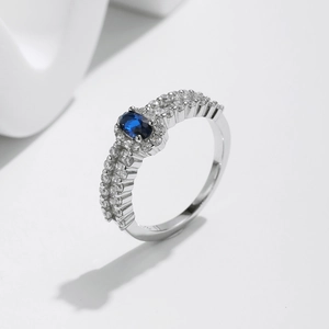 Elegant s925 silver ring featuring a large oval blue gemstone with sparkling pavé accents