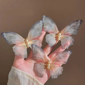 Elegant tulle butterfly hair clips with gradient colors and pearl details in three pack