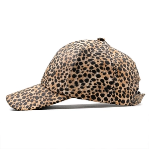 Close-up of leopard print baseball cap featuring textured pattern and adjustable metal buckle