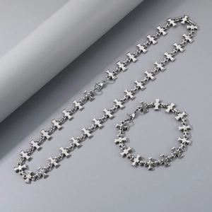 Detailed view of silver stainless steel cross chain necklace and bracelet set
