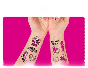 Detailed view of pink western cowgirl temporary tattoos applied on skin for parties