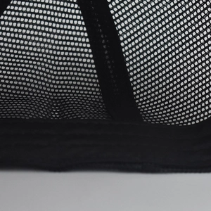Close-up of the black trucker hat rear showing breathable mesh fabric and detailed stitching