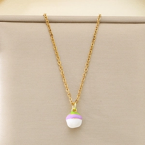 Detailed close-up of a golden cable chain necklace with a colorful fruit enamel pendant