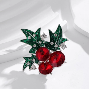 Elegant Christmas holly berry brooch with red rhinestones and green enamel on silver base