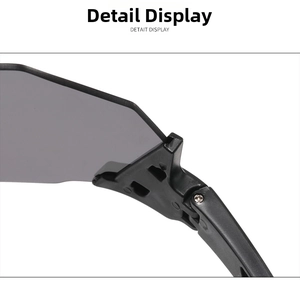 Macro detail of sports sunglasses hinge showing matte black frame and grey lens construction