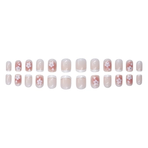 Pink and white gradient press-on nails with cherry blossom patterns and silver glitter trim