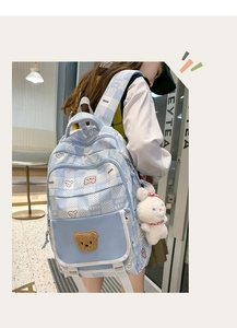 Blue plaid school bag with a cute teddy bear patch and plush rabbit charm detail