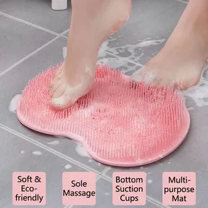 Pink silicone foot massage mat with suction cups and soft bristles for bathroom shower use