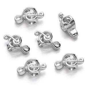 Detail of silver treble clef beads for DIY necklaces and bracelets accessories
