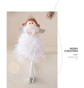 Detail of Christmas angel hanging ornament with white feather dress and wooden heart snowflake