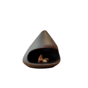 Minimalist dark ceramic Palo Santo holder and sage incense burner on white background
