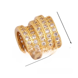 Macro detail of 9mm gold charm bead with four rows of pave-set cubic zirconia