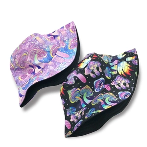 Reversible bucket hat with psychedelic mushroom and eye print in purple and black