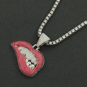 Close-up of sparkling red and white rhinestone lips pendant on silver tennis chain