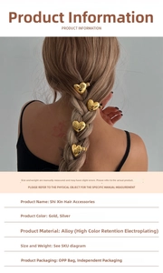 Détail de quatre pinces à cheveux en alliage doré en forme de cœur sur une tresse