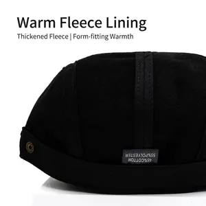 Thick warm black newsboy cap with fleece lining made of cotton and polyester blend