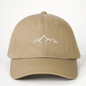 Beige cotton baseball cap with white mountain embroidery and adjustable strap