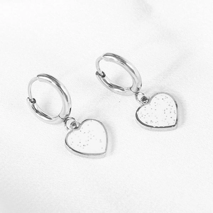 Elegant gold heart earrings with white glitter charm and stainless steel hoop closure