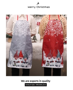 Close-up of Christmas gnomes and snowflake prints on grey and red burlap aprons