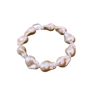 Irregular baroque pearl magnetic bracelet with champagne tone and geometric metal clasp