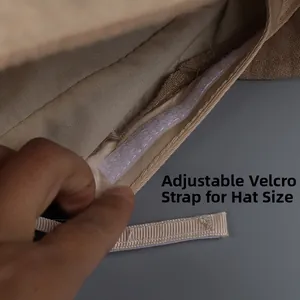 Detail view of the adjustable velcro strap inside the linen sun hat for customized fit
